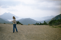 Helen taking a picture of the view over the Golfe de Girolata, on the road to Portu