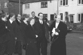 Milling outside the church